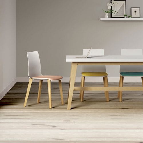white Pledge Fjord Office Breakout Chairs with upholstered seats and wooden legs
