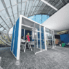 angled shot of the hoozone office pod with blue and white colour scheme uk manufactured office design by era