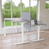 imperial office furniture radial freedom x height adjustable desk with screen inbetween with grenery in background
