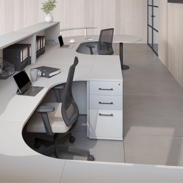 back view of the receptiv reception desk range in grey with black accents. showing desk high pedestal and black mesh chair