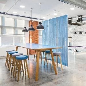 Blue Centro high table with wooden frame and blue bar stools