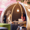 close up of people socialising in the escape office pod uk manufactured office design furniture