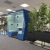 two tone blue bill office pod with biophillia in open plan office. commerical office interior design inspiration