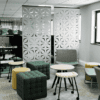 white diamond patterned lull suspended acoustic panel in a white modern office