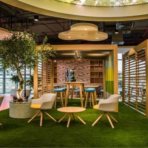 Rollie Chairs wooden legs in a open reception or breakout area in a modern office