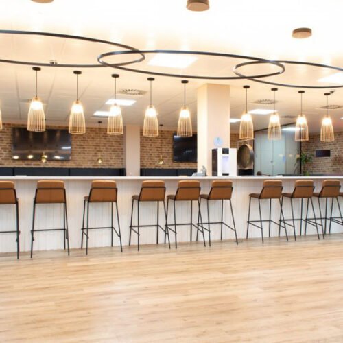 Sling high stools in a stylish breakout area