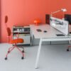 Modern bench desk system in a colorful office