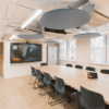 corporate meeting room with allsfar aurora acoustic ceiling raft in lgiht blue pet felt