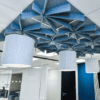 close up of the flott acoustic panels from allsfar with pendant acoustic lighting underneath