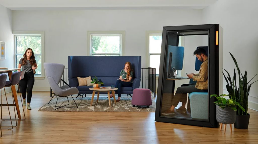 Colorful open plan office with acoustic seating pods