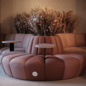 JDD Furniture Terry seating range, with soft plants behind. Integrated coffee tables