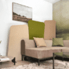 identity furniture ryve floor standing screens in beige and green fabric behind comfy modern sofa, perfect for breakout and collaborative office areas