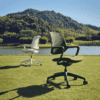 edit office ux mesh chairs in green and white in an outside setting
