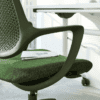 edit office ux mesh chair in green close up with desk in background