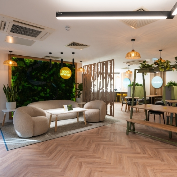 Biophilic breakout area with soft furnishings and sustainable timber accents in Ringwood office.