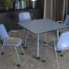 Serenity small meeting table in blue surrounded by 4 office chairs in a meeting room