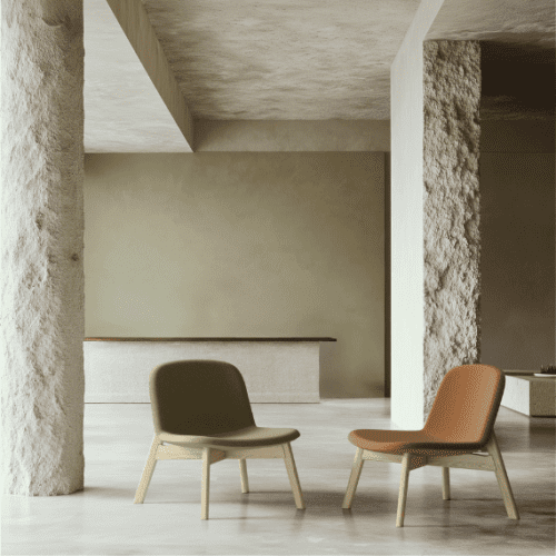 two tully tully wooden four-legged lounge chairs in a breakout setting