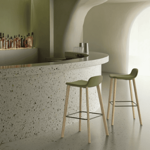 two tully wooden four legged bar stools with upholstered seats around a bar setting