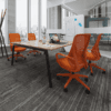 orange eva mesh chair in office setting