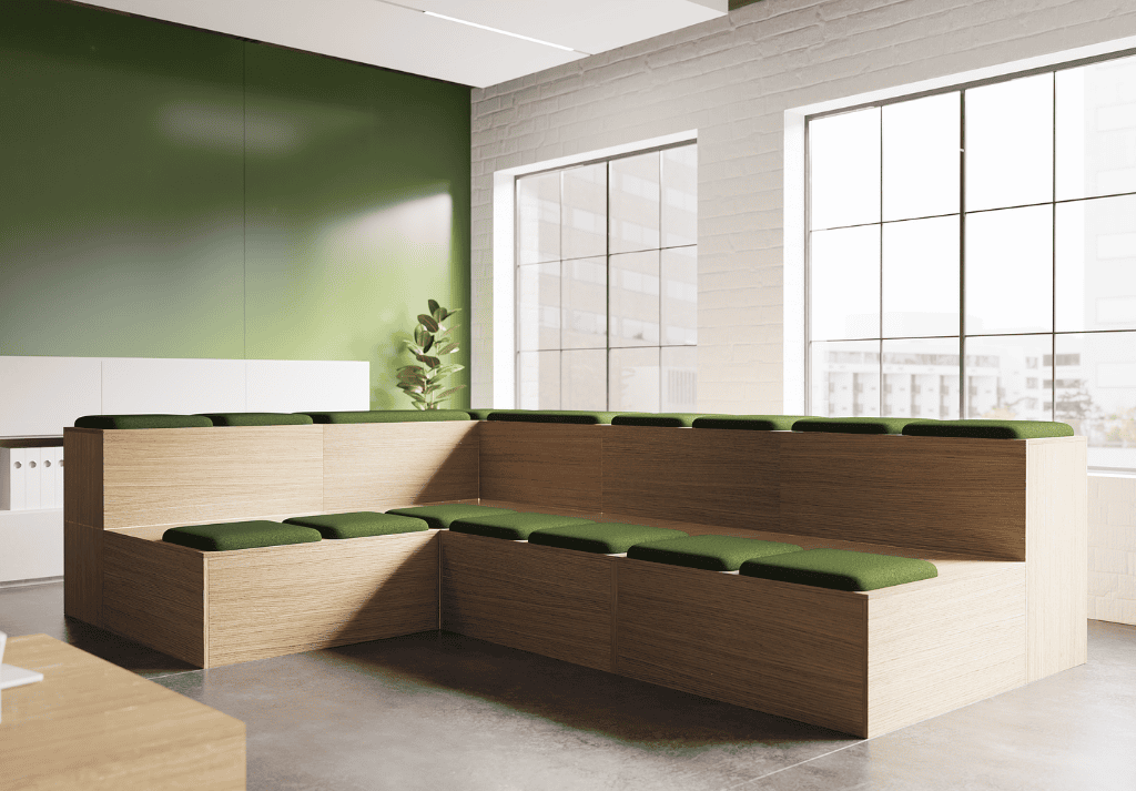 Bespoke Theo tiered seating placed centrally with wooden safety panels and laptop tables for hybrid collaborative working