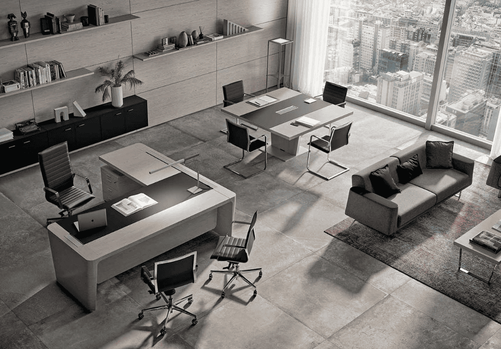 Ergonomic office chair and executive office chair side by side in a modern office workspace showing differences in design and support.