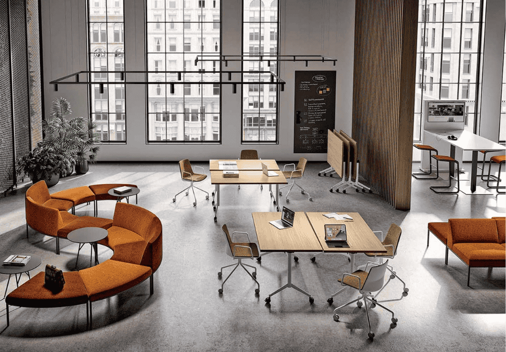 Hybrid office space with modular desks, mobile pedestals, and collaborative seating