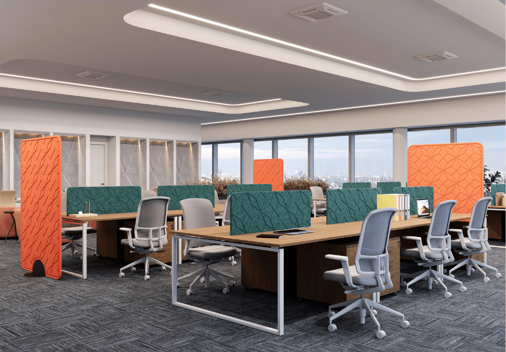 Open-plan office with desk screens, acoustic panels, and modular seating