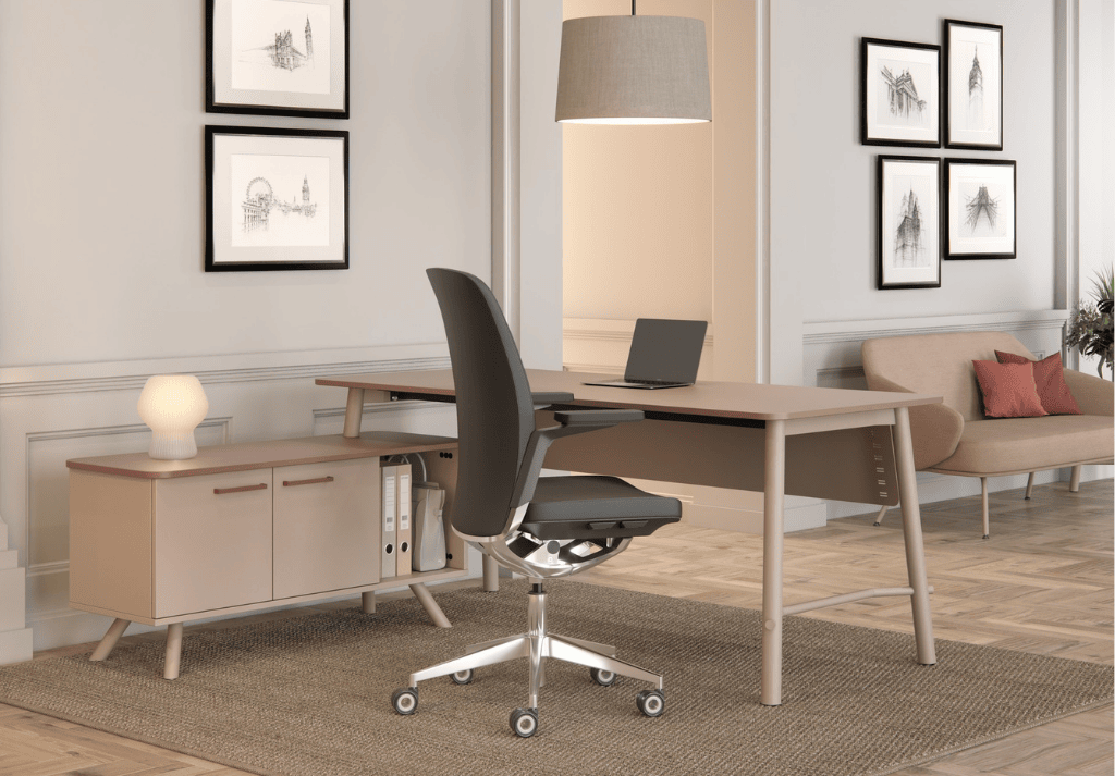 Executive workspace with partner desks, visitor chairs, and monitor arms for collaboration