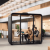 four person smart office pod from framery with people in a meeting essentials range