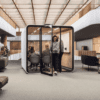 6 person lite range smart office pod from framery office solutions with whiteboard, white exterior design