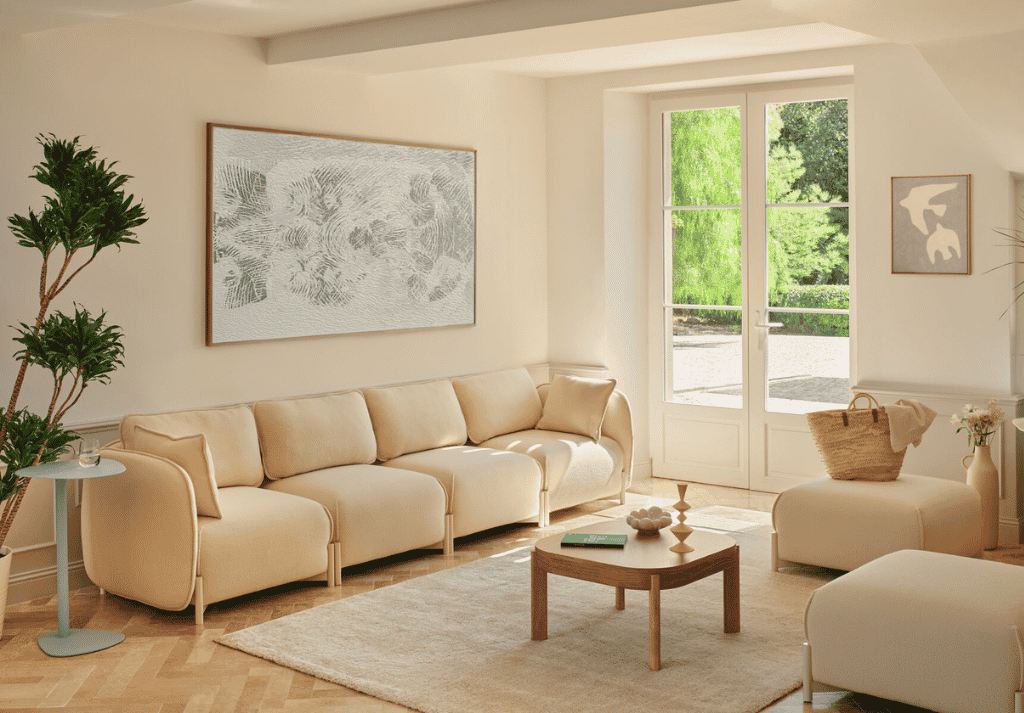 Modern office breakout area with relaxed seating, plants and informal meeting space