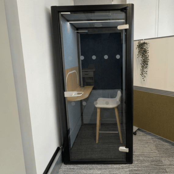 private workpod by era in their 10 great sutton steet lodnon showroom with blue interior and high stool
