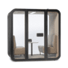 Interior view of the Kalm Smart Pod featuring acoustic wool-lined walls, daylight-style LED lighting and a private workspace for video calls and concentration.