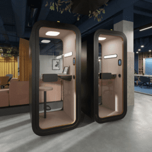 Kalm Work Pod with height-adjustable desk, ergonomic workspace and smart controls, designed for focused individual work within busy office environments.