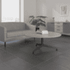 imperial axis coffee table circular in slate with black 4 star base with two person grey sofa