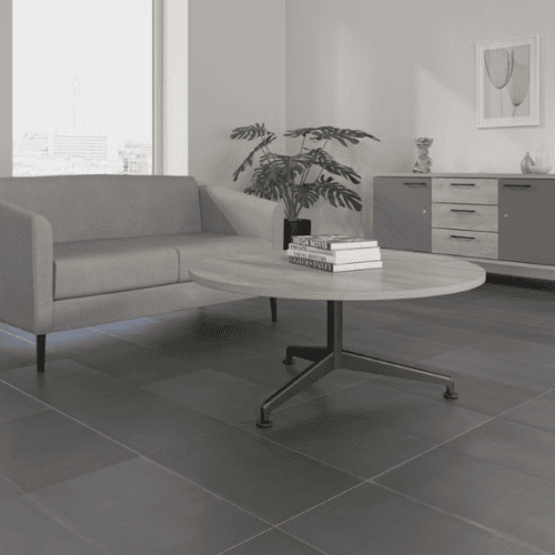 imperial axis coffee table circular in slate with black 4 star base with two person grey sofa