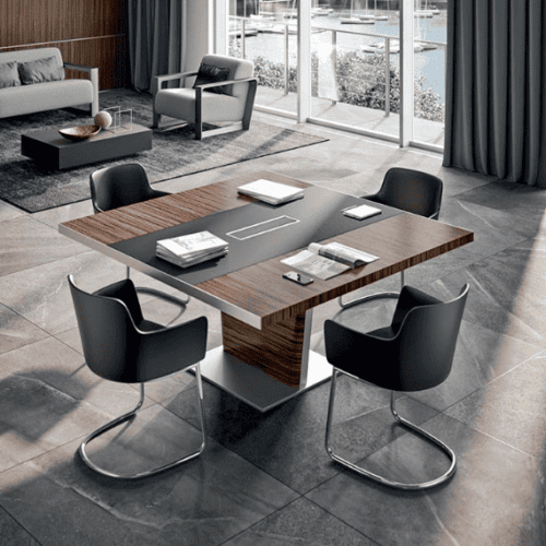 Modern executive meeting room with the X10 modular meeting table in premium wood finish, surrounded by stylish boardroom chairs.