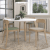 round lux boardroom table in white with wooden legs and cafe style chairs