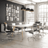 white lux boardroom table with executive black leather meeting chairs and pendant lighting above