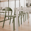 mina chair from pledge with upholstered seat and green colour in classroom setting
