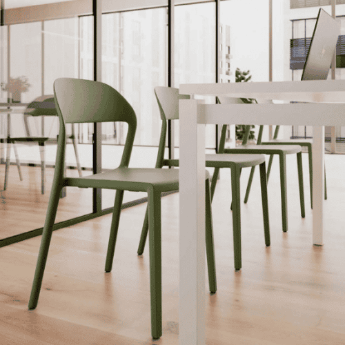 mina chair from pledge with upholstered seat and green colour in classroom setting