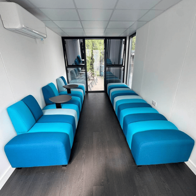 Blue soft seating creating a welcoming student breakout area at a sixth form college